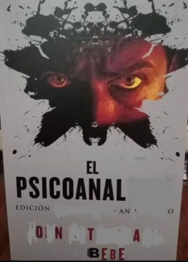 Portada de libro con el título modificado "El Psicoanal" y "Onta Bebe" sobre una imagen de rostro demoníaco al estilo Rorschach.